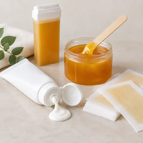 Depilatory cream and wax product formats compared on a neutral studio surface